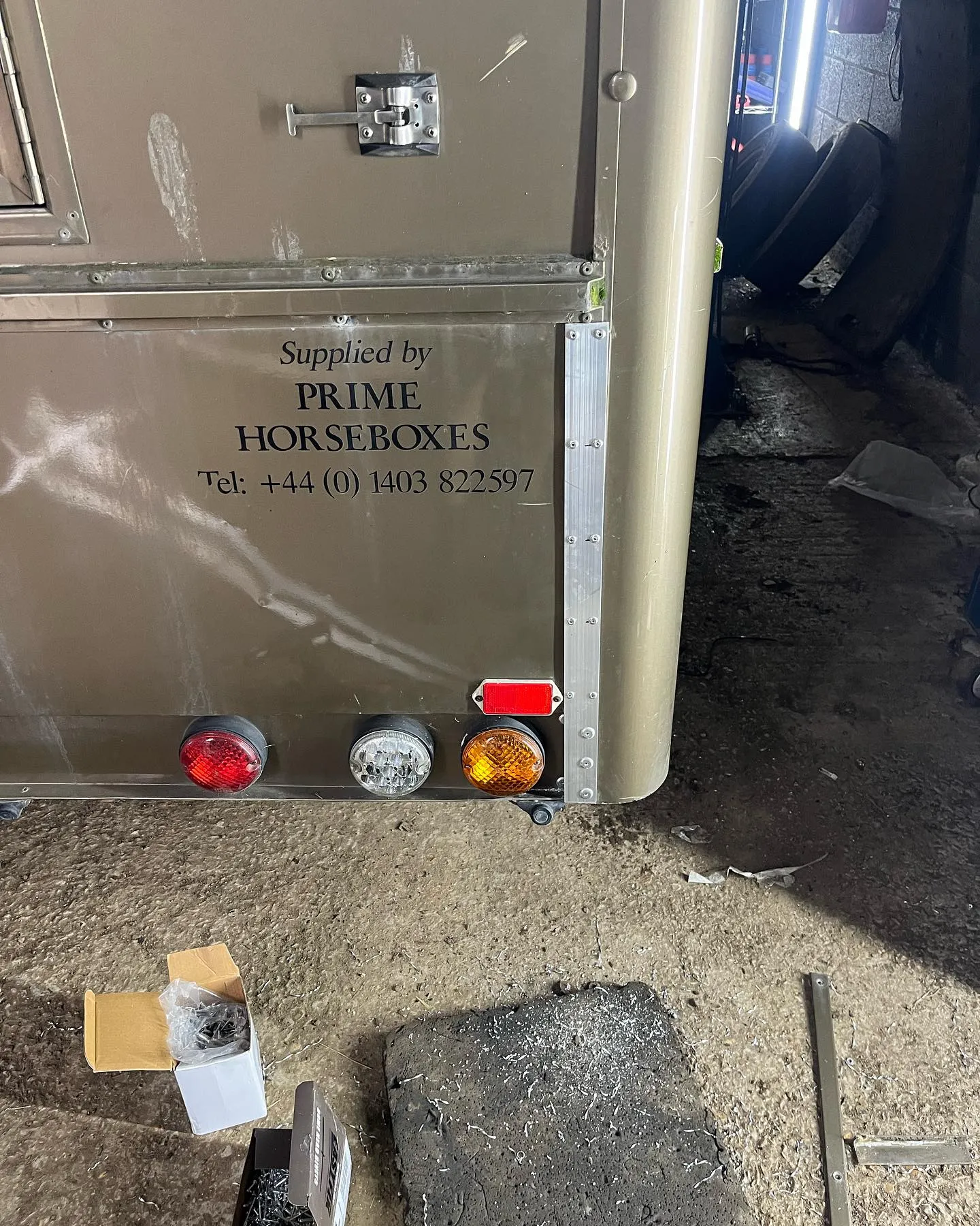 There is a metal box with a sign on it.