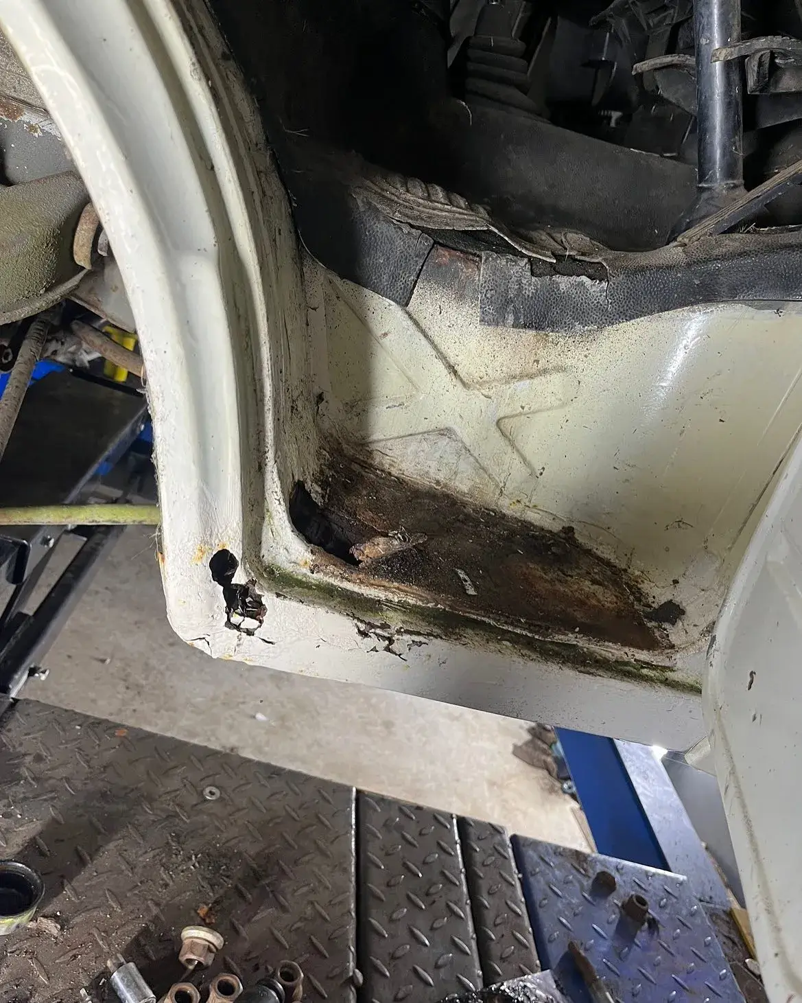 A car that is sitting in a garage.